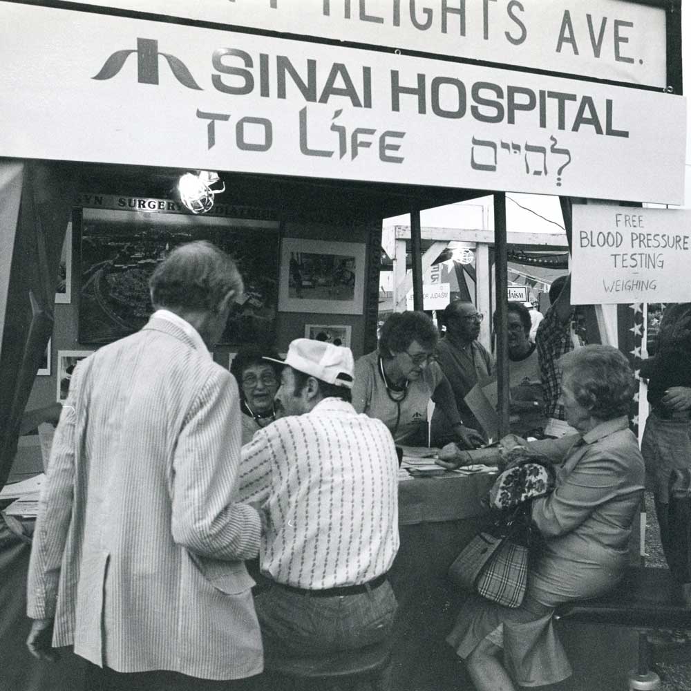 Historical photograph of a Sinai Hospital community wellness booth